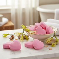 Sensuale Heart Bath Bombs in bowl with ylang ylang flowers